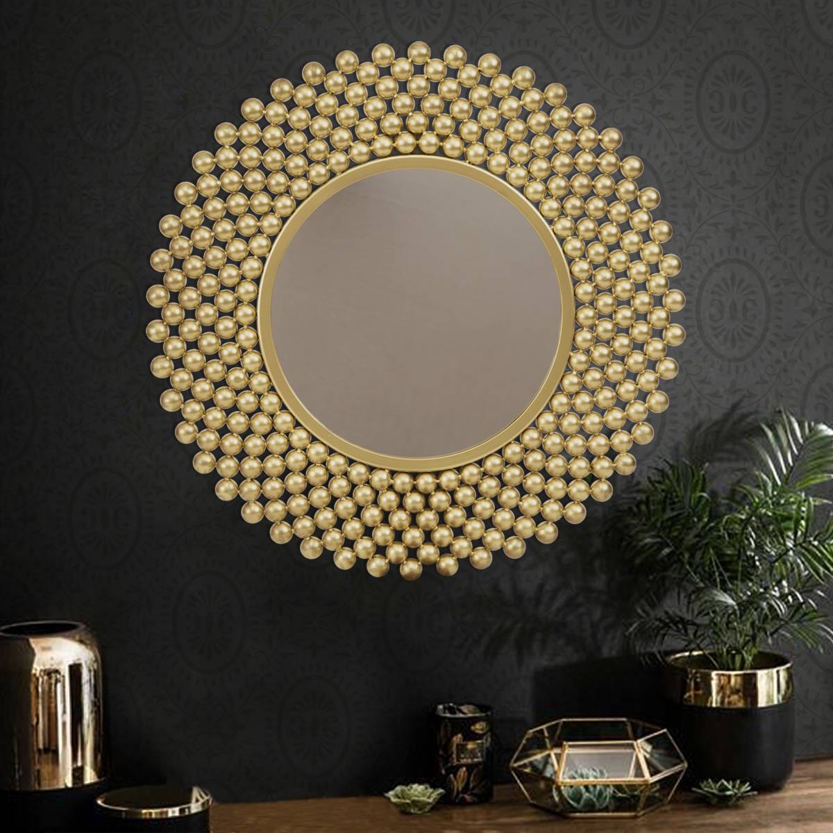 Golden round shape wall mirror, offering a luxurious accent to home decor